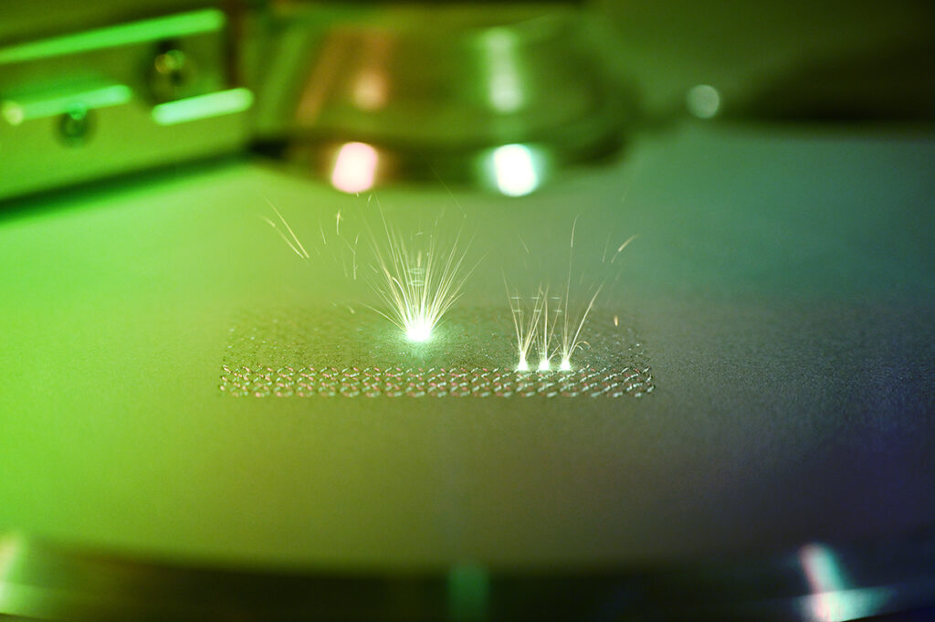 A laser powder bed fusion additive manufacturing system in action.